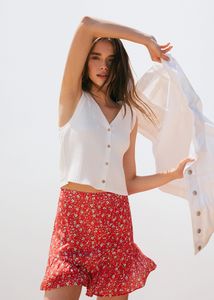 Ruffle flower print miniskirt offers at $39.99 in Mango