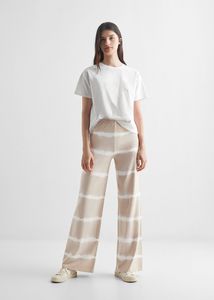 Tie-dye print trousers offers at $34.99 in Mango